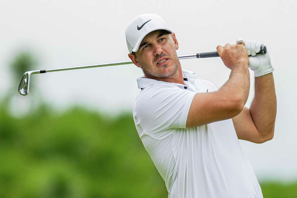 FILE - Captain Brooks Koepka of Smash GC hits his shot from the 15th tee during the final round of LIV Golf Singapore at the Sentosa Golf Club on Sunday, April 30, 2023, in Sentosa, Singapore. Koepka is expected to compete in the PGA Championship next week at Oak Hill Country Club in Pittsford, N.Y. (Ashok Kumar/LIV Golf via AP, File)