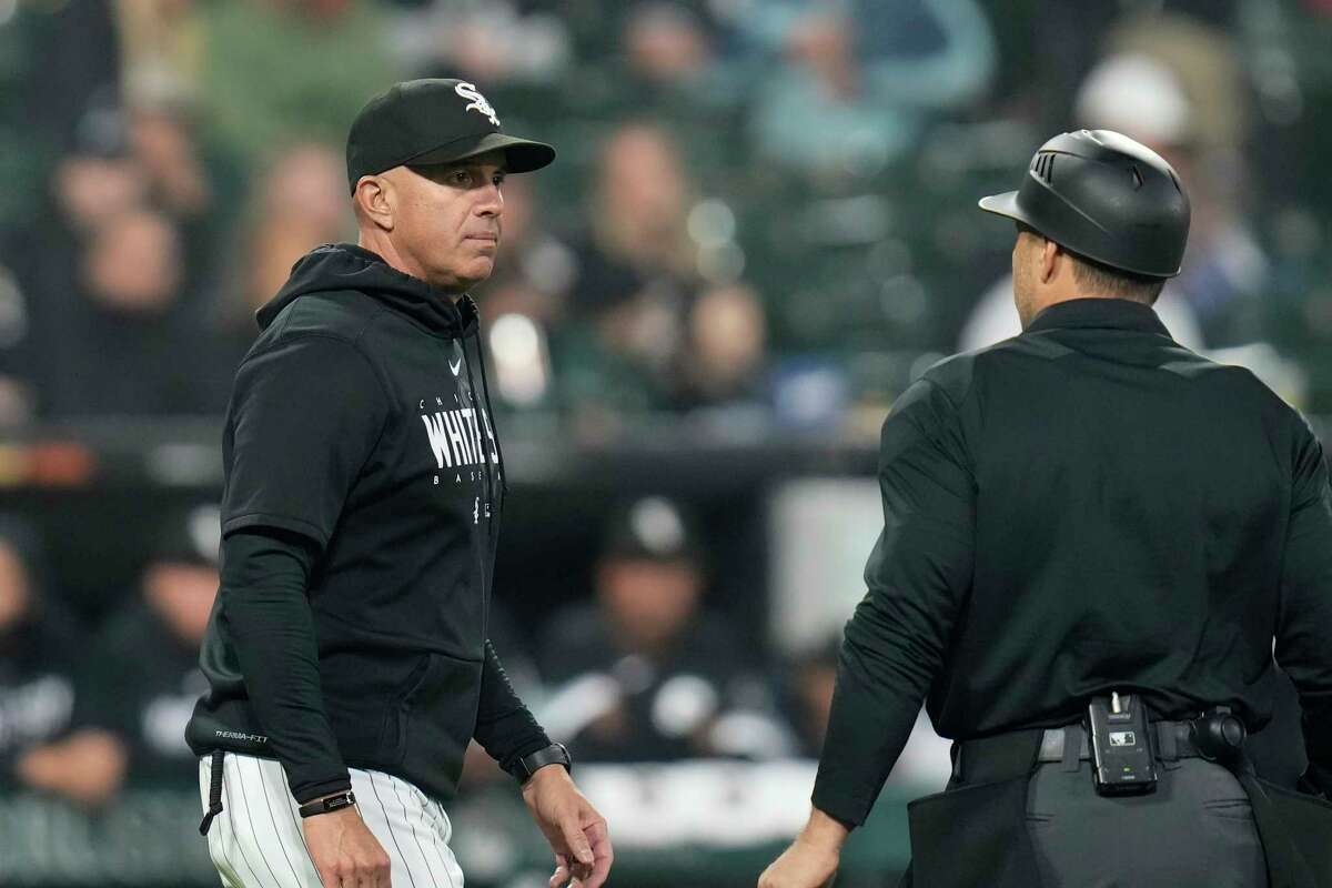 Chicago White Sox manager Pedro Grifol, left, talks to an umpire during the third inning of a baseball game against the Houston Astros, Friday, May 12, 2023, in Chicago.