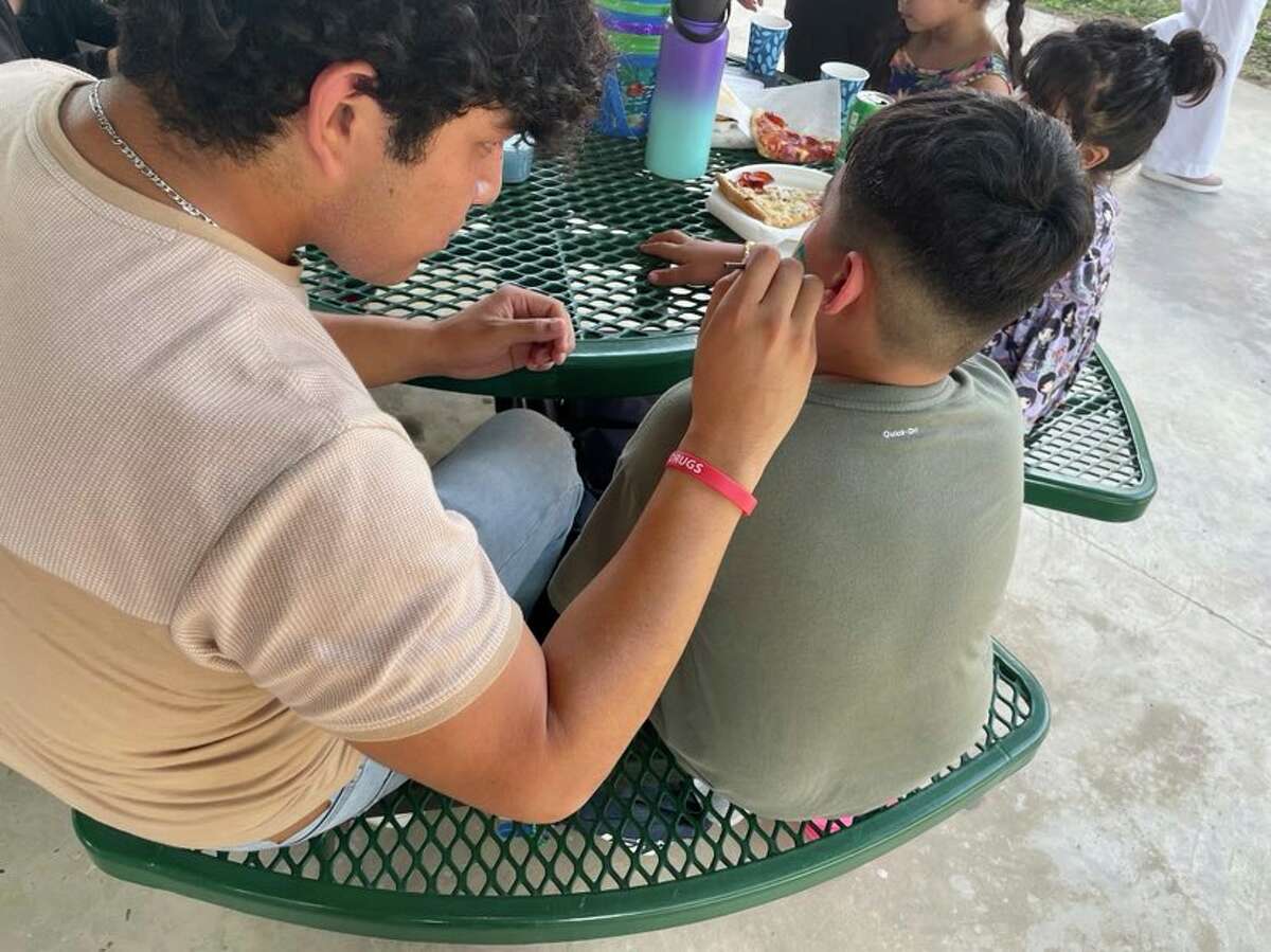 Volunteers of Martin's Sociedad Honoraria Hispánica helped care for the children during the Mother's Day celebration at Casa de Misericordia, on Wednesday, May 10, 2023.