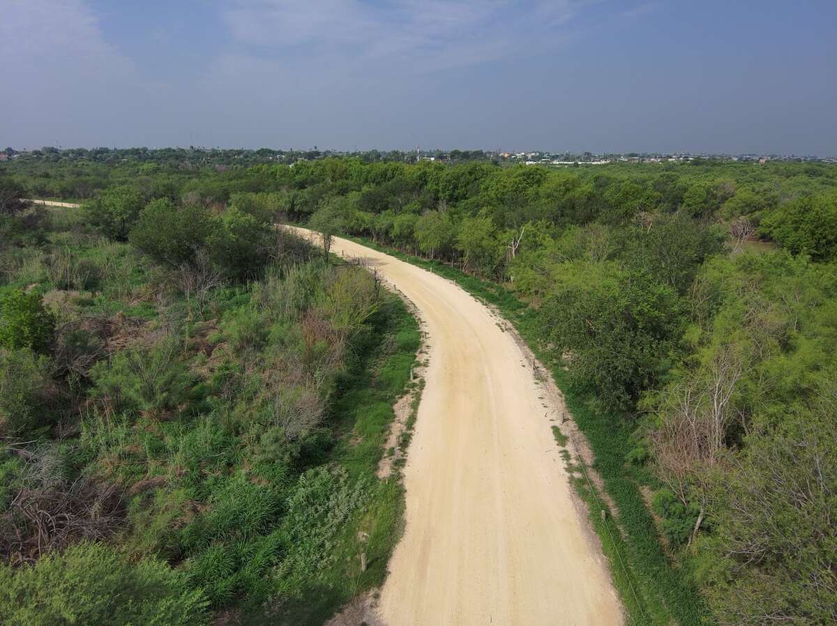 Pictured is the all-weather road located near the riverbanks on Laredo College Main property. The local Border Patrol union is lobbying for its Road Project Initiative while others debate environmental concerns ahead of a vote by City Council on Monday, May 15, 2023. 