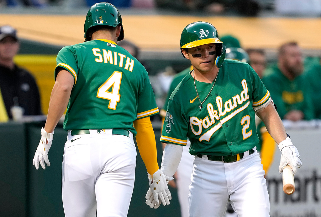 A's face pick between young infielders with Aledmys Díaz due back from