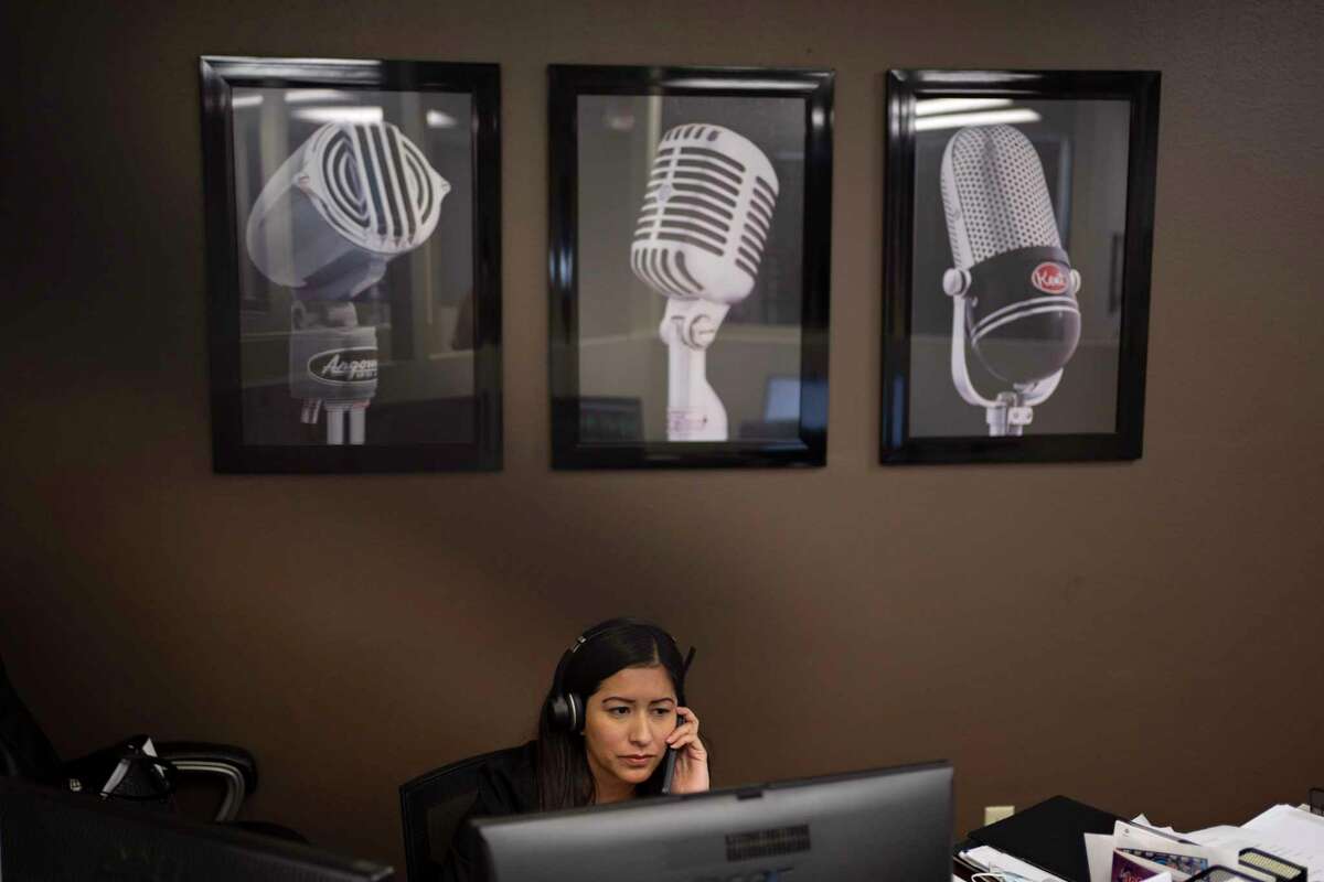 Bryan Broadcasting sales representative Nelly Mauricio talks on the phone at the station in College Station, Tex.