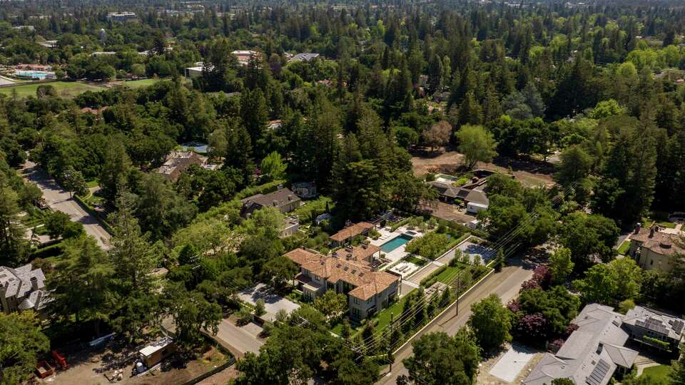 Homes can be seen in a neighborhood in Atherton, Calif. on Sunday, May 14, 2023. Many homes located near the boundaries by Elena, Santiago and Valparaiso Avenues and Park Lane are owned by trusts and LLCs.