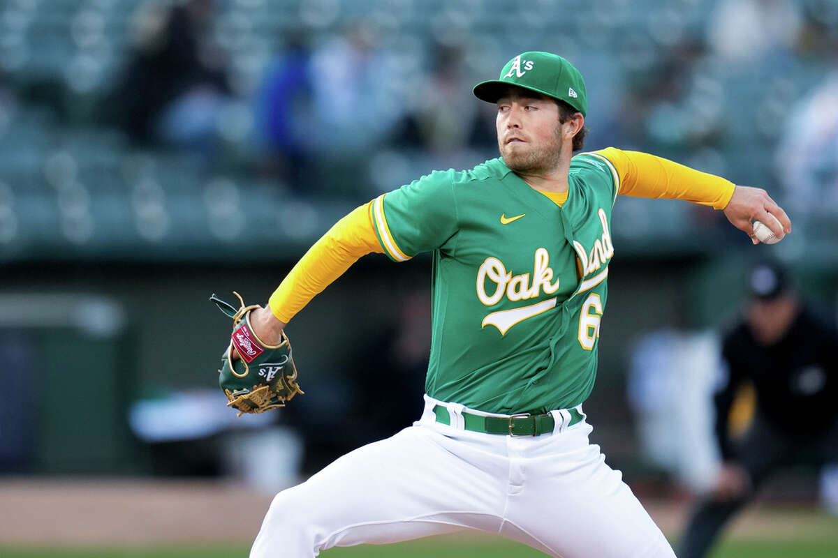 Starting pitcher Ken Waldichuk of the Oakland Athletics pitches