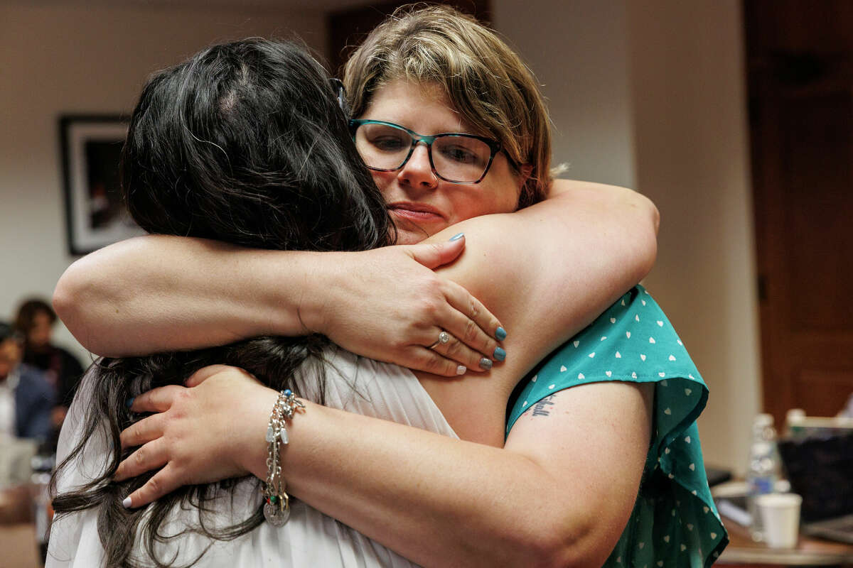 Rhonda Hart, right, hugs Christina Delgado before leaving the Capitol in Austin, Tuesday afternoon, April 18, 2023, to drive back to Santa Fe.