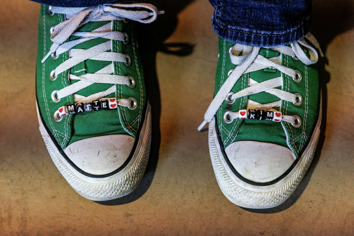 Rhonda Hart’s green converse are customized with beads spelling out the name of Uvalde massacre victim Maite Rodriguez on one side and her daughter Kimberly Vaughan on the other. Hart’s daughter was killed in the Santa Fe High School shooting in May 2018.