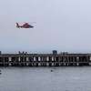 据报道,一架直升机搜索一个人掉了鱼雷在旧金山码头的要塞。
