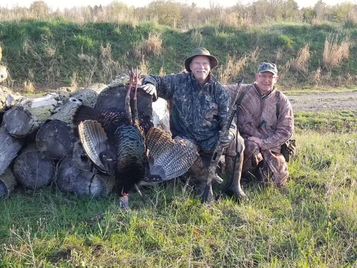From left are champion turkey caller Rodd Little and Tom Lounsbury with a dandy gobbler that Tom bagged near Standish. 
