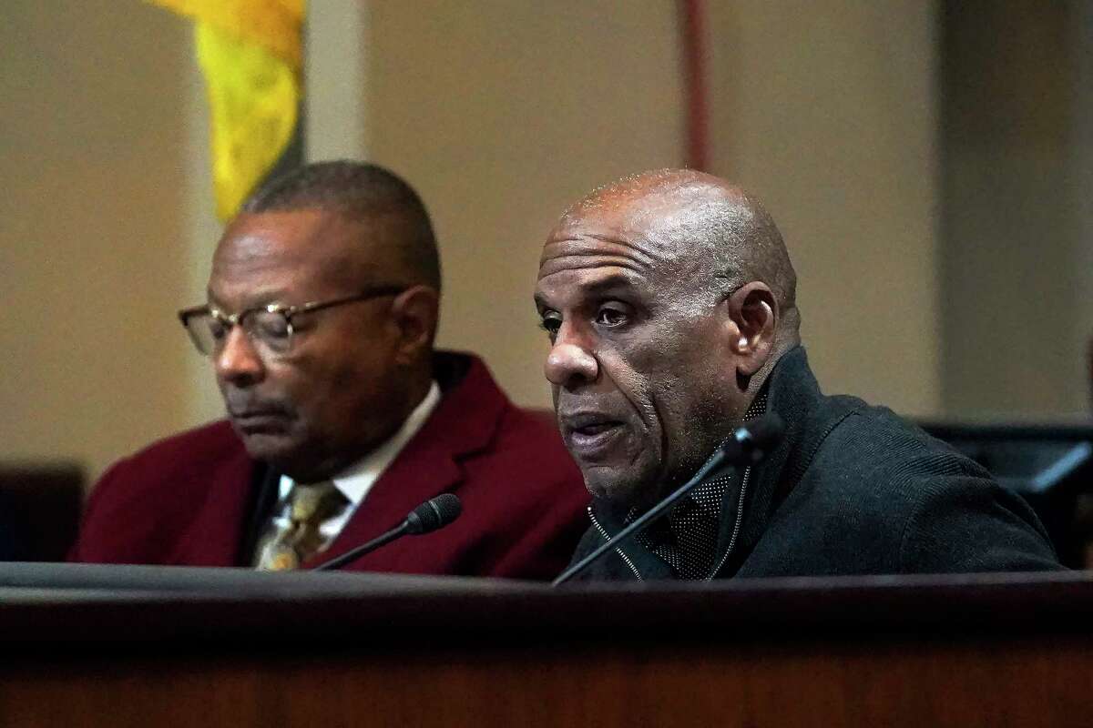 Reparations task force members Steven Bradford (right) and Reginald Jones-Sawyer appear at a meeting in Oakland in December.