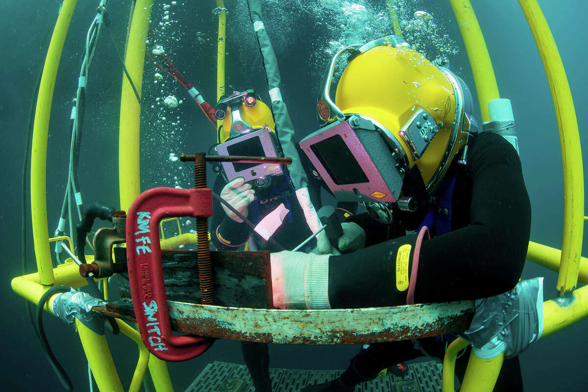 A U.S. Navy Diver practices underwater welding.