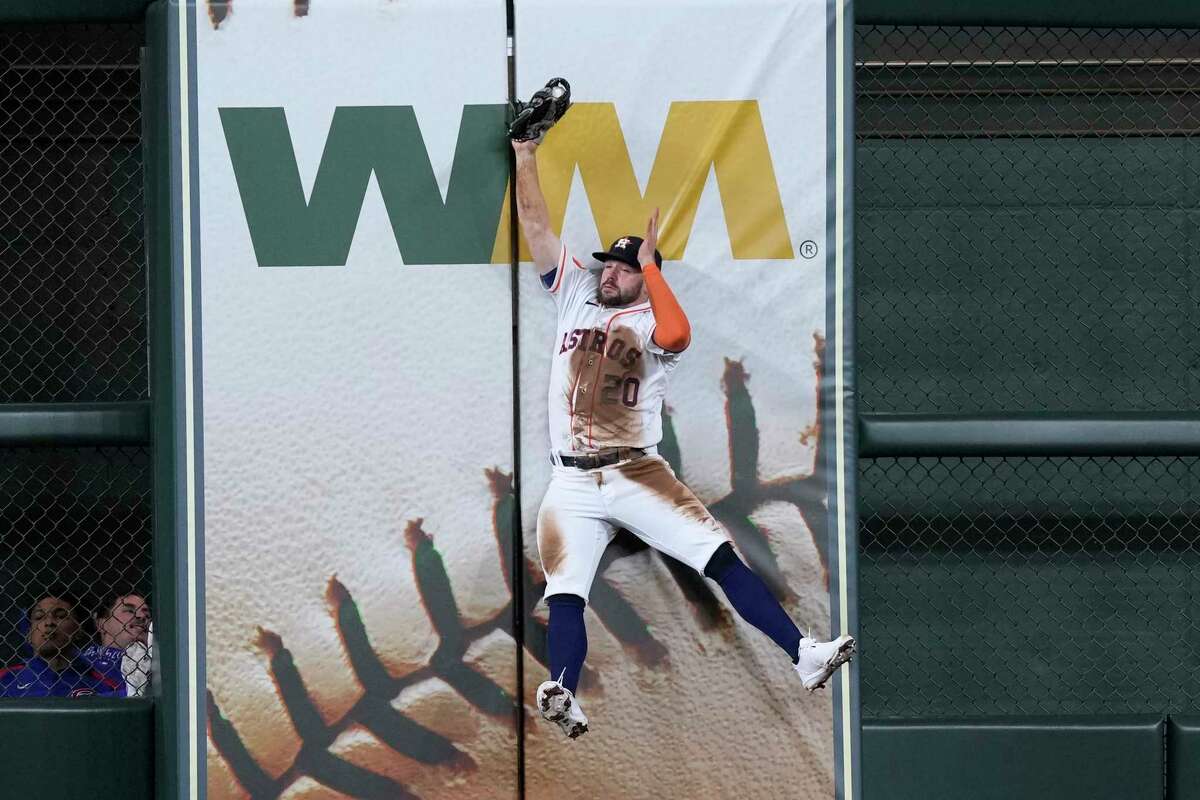 Houston Astros center fielder Chas McCormick catches a fly ball by Chicago Cubs' Dansby Swanson during the sixth inning of a baseball game Tuesday, May 16, 2023, in Houston.