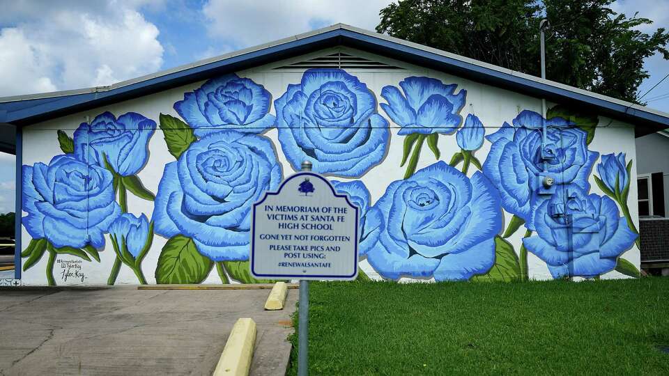 A mural on the Allstate Insurance office in Santa Fe dedicated to the victims of the shooting. Memorials marking the mass shooting on May 18, 2018 at Santa Fe High School on Wednesday, May 17, 2023 in Santa Fe.