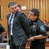 Nauman Hussain is taken into custody after 20 guilty verdicts of manslaughter are read, one for each person killed in an Oct. 6, 2018, limousine crash, on Wednesday, May 17, 2023, in Schoharie County Court in Schoharie, NY.