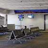 旅行者在终端在旧金山国际机场等待周三在冠状病毒大流行,2020年4月1日。