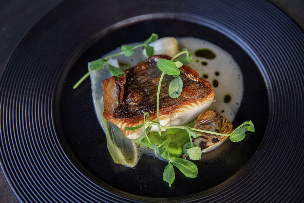 Seared Black Cod with artichoke barigoule, tarragon, and english pea at Marlena in San Francisco, Calif. on May 16, 2023.