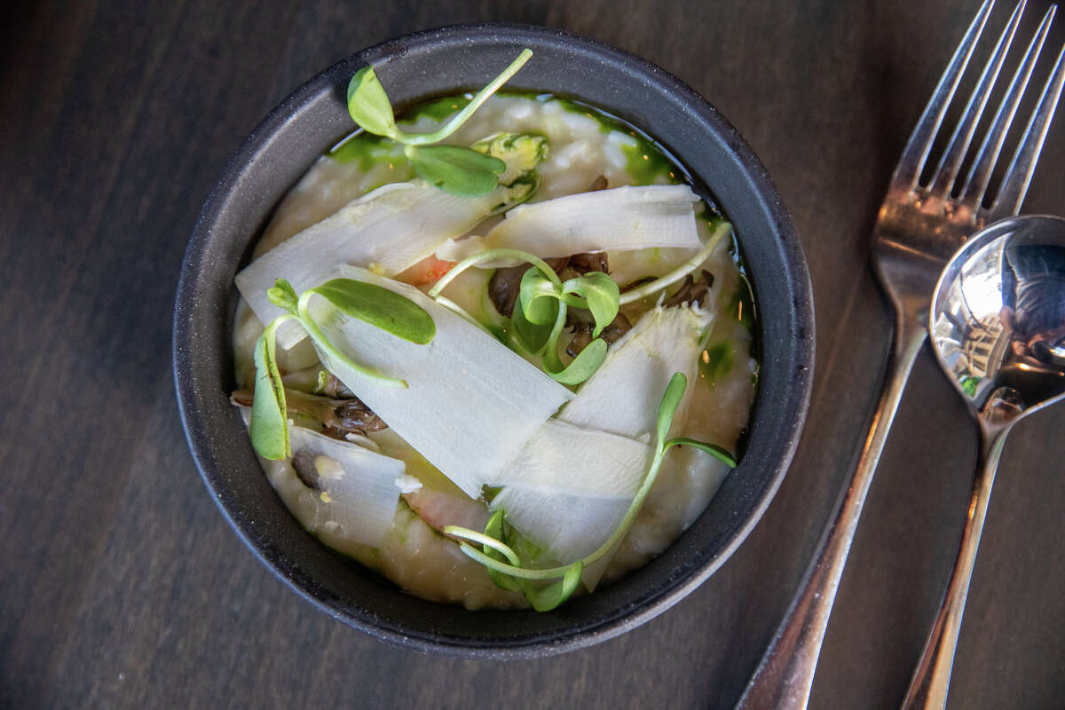 The Provençal white asparagus risotto with green strawberry, sunflower sprout and nasturtium at Marlena in San Francisco on May 16, 2023.