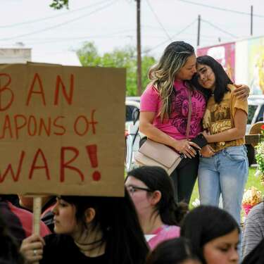 Gladys Castillón embraces her 11-year-old daughter Kaitlyn Martinez, during a walkout to protest gun violence in April. Kaitlyn was a fourth-grader at Robb Elementary last May.