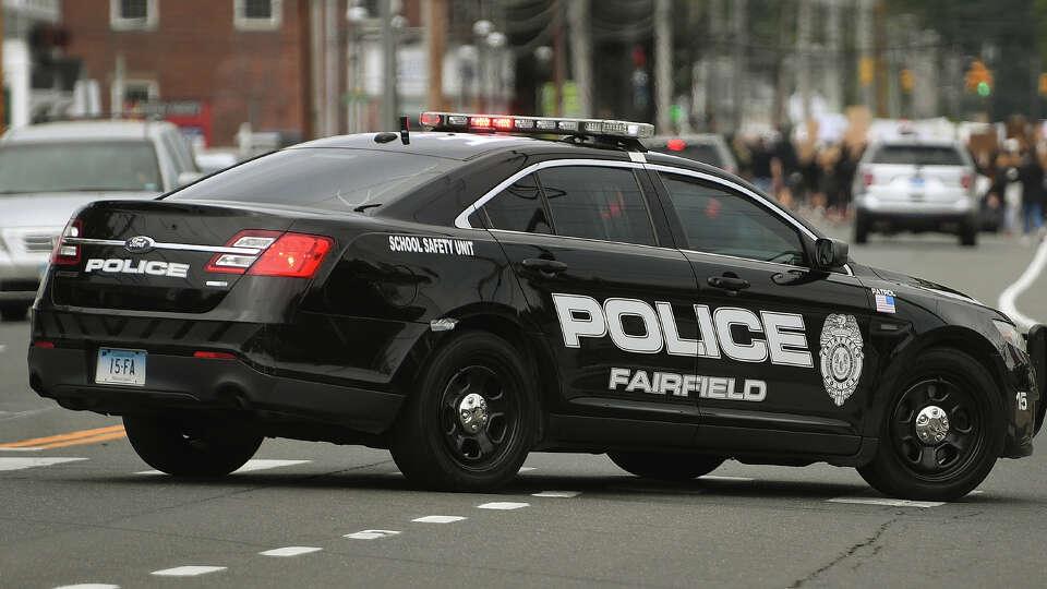 A file photo of a Fairfield, Conn., police cruiser. Fairfield police identified the man who died after being hit by a vehicle in a Post Road parking lot Wednesday morning as a surveyor from Colchester. 