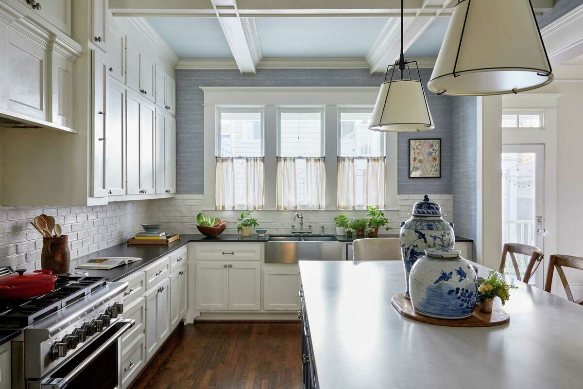 In the kitchen, they added wallpaper, new lighting and window treatments. 