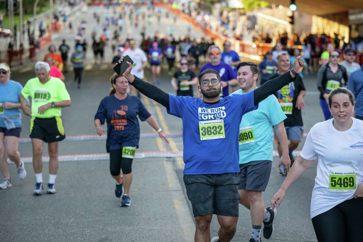 Runners reach the finish during the 2023 CDPHP Workforce Team Challenge, the largest running event in the Capital Region, on Thursday, May 18, 2023, in Albany NY.