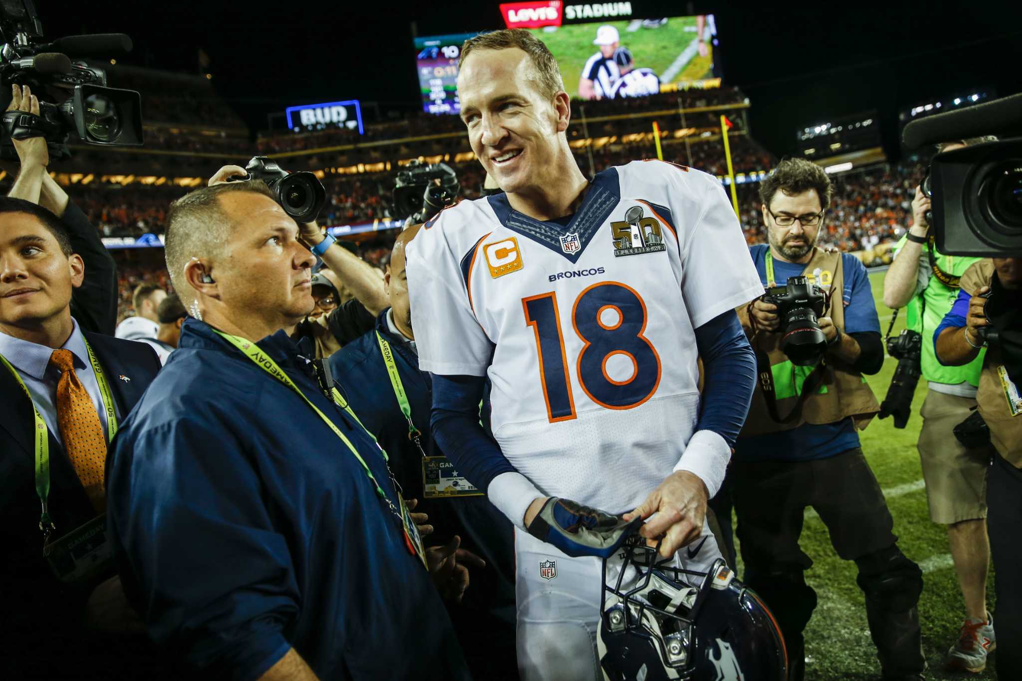 Denver Broncos QB Peyton Manning's son reaches for the Lombardi trophy at Super  Bowl 50 at Levi's Stadium in Santa Clara, California on February 7, 2016.  Denver wins Super Bowl 50 defeating