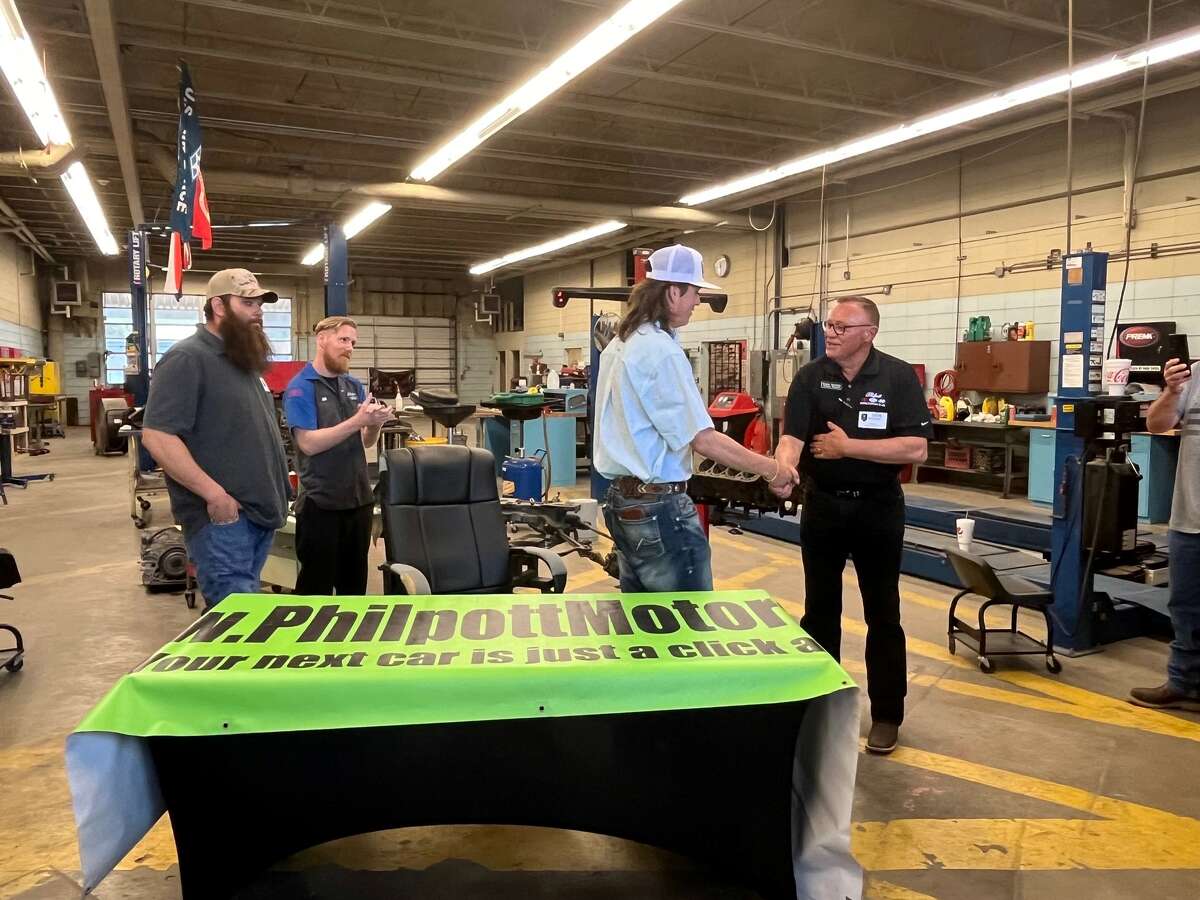 Nederland High School senior Tanner Garcia signs a letter of intent to work for Philpott Motors after graduation, May 17, 2023.