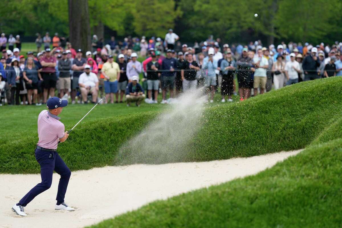 Justin Thomas hits from the bunker on the fifth hole during the second round of the PGA Championship golf tournament at Oak Hill Country Club on Friday, May 19, 2023, in Pittsford, N.Y.