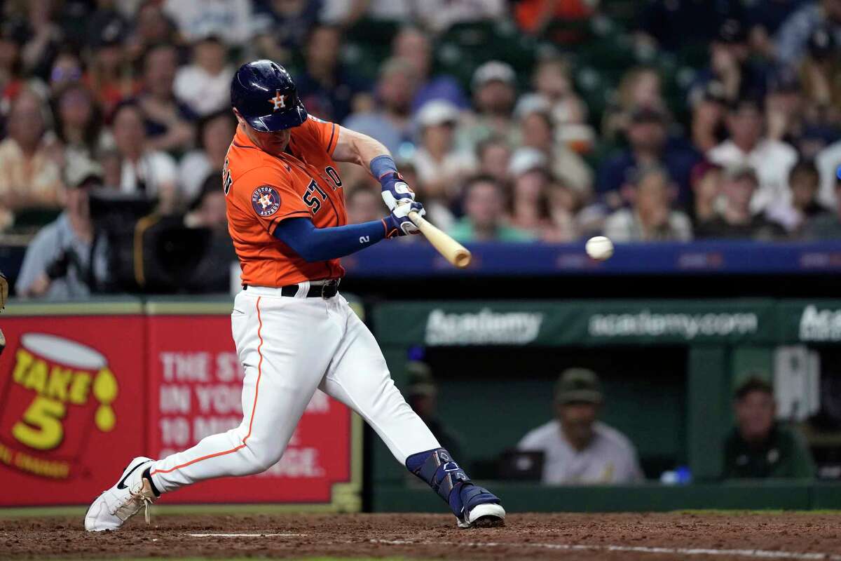 Houston Astros' Alex Bregman hits an RBI single against the Oakland Athletics during the eighth inning of a baseball game Friday, May 19, 2023, in Houston.