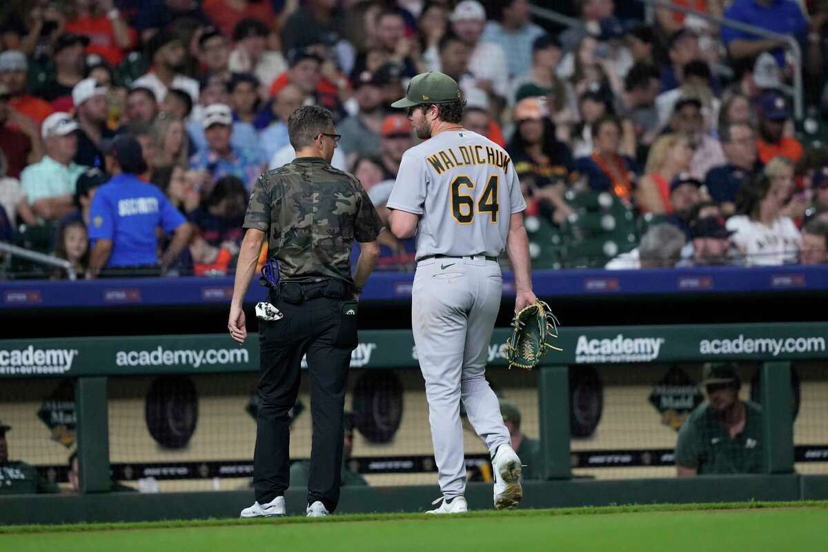 Oakland Athletics starting pitcher Ken Waldichuk (64) leaves during the sixth inning of a baseball game against the Houston Astros Friday, May 19, 2023, in Houston.