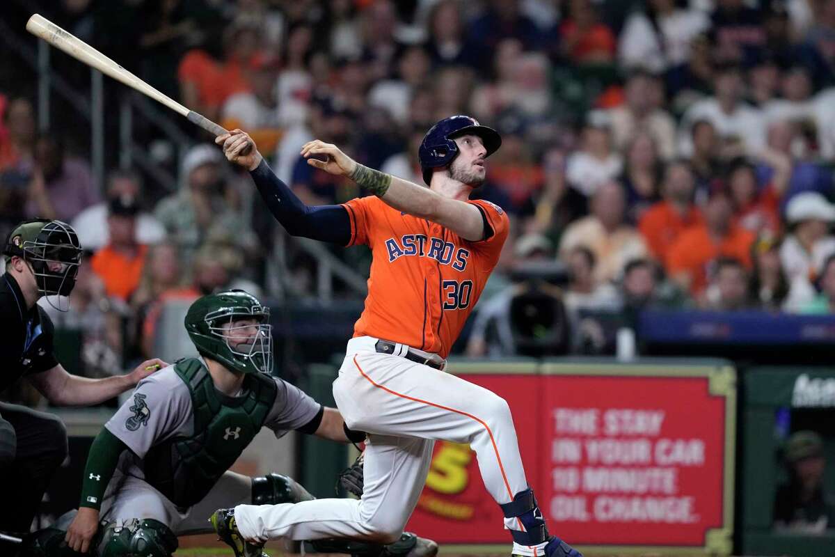Houston Astros' Kyle Tucker (30) hits a two-run home run as Oakland Athletics catcher Shea Langeliers watches during the sixth inning of a baseball game Friday, May 19, 2023, in Houston.
