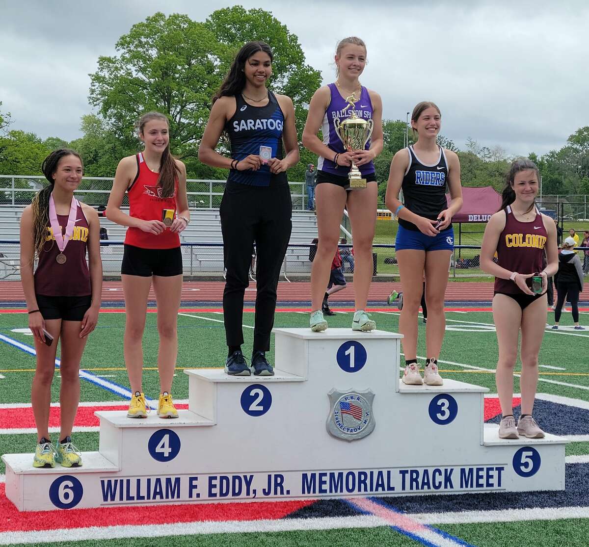 Ballston Spa’s Harriet Healey stands atop the podium after her win in the 400 at the Eddy Meet on Saturday at Schenectady High School.