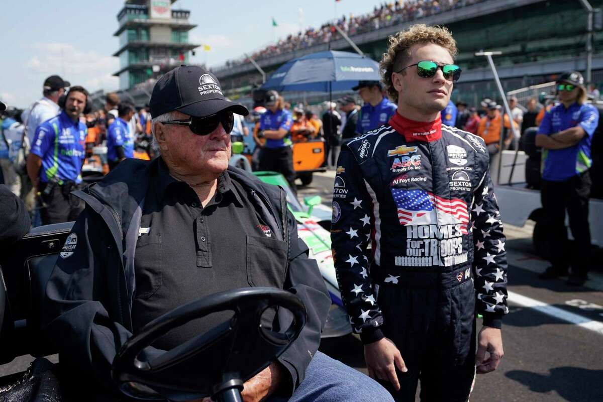 A.J. Foyt, left, talks with Santino Ferrucci during qualifications for the Indianapolis 500 auto race at Indianapolis Motor Speedway, Saturday, May 20, 2023, in Indianapolis.