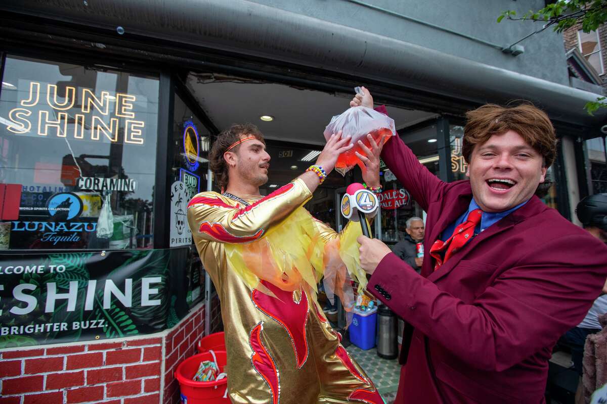 Revellers enjoy the Bay to Breakers footrace on Divisadero Street, San Francisco. May 21, 2023. 