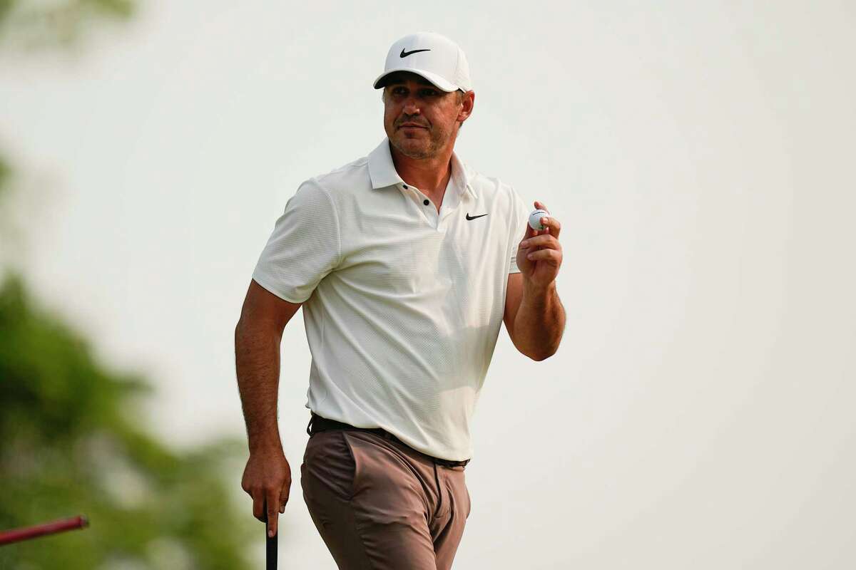 Brooks Koepka waves after his putt on the 15th hole during the final round of the PGA Championship golf tournament at Oak Hill Country Club on Sunday, May 21, 2023, in Pittsford, N.Y.