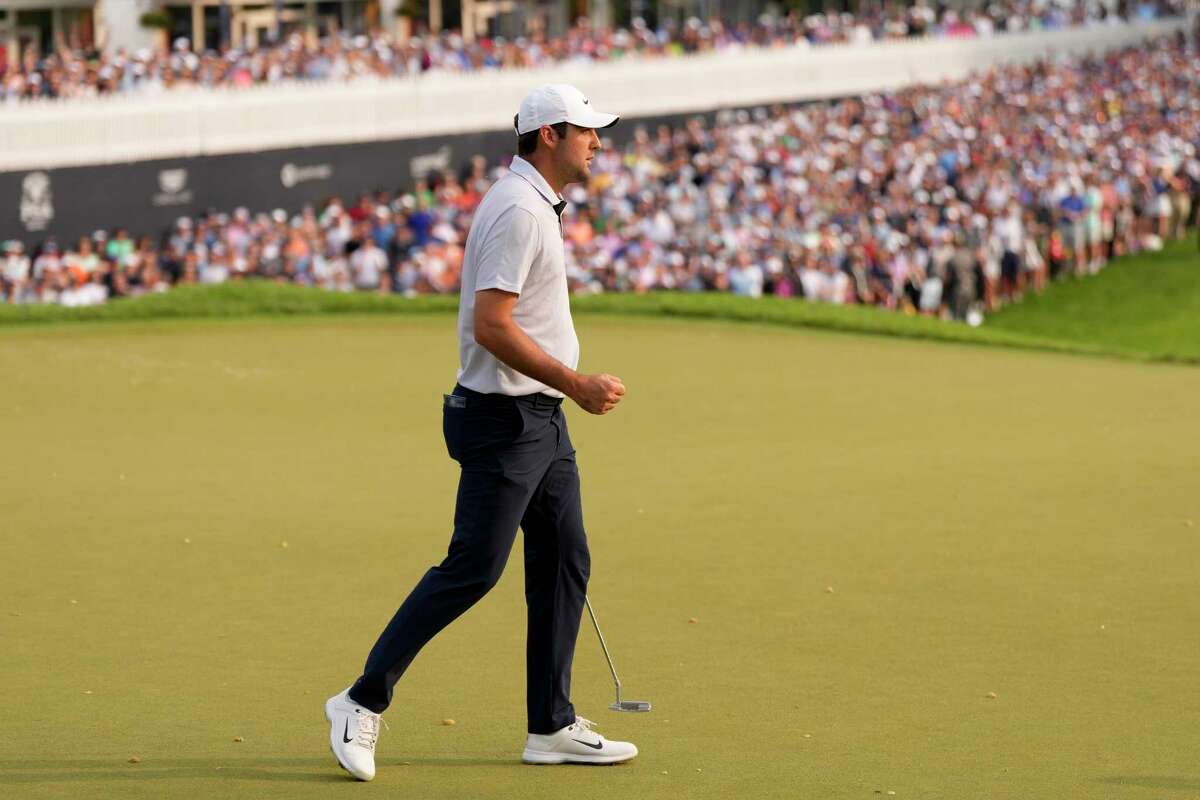 Scottie Scheffler celebrates after his putt on the 18th hole during the final round of the PGA Championship golf tournament at Oak Hill Country Club on Sunday, May 21, 2023, in Pittsford, N.Y.