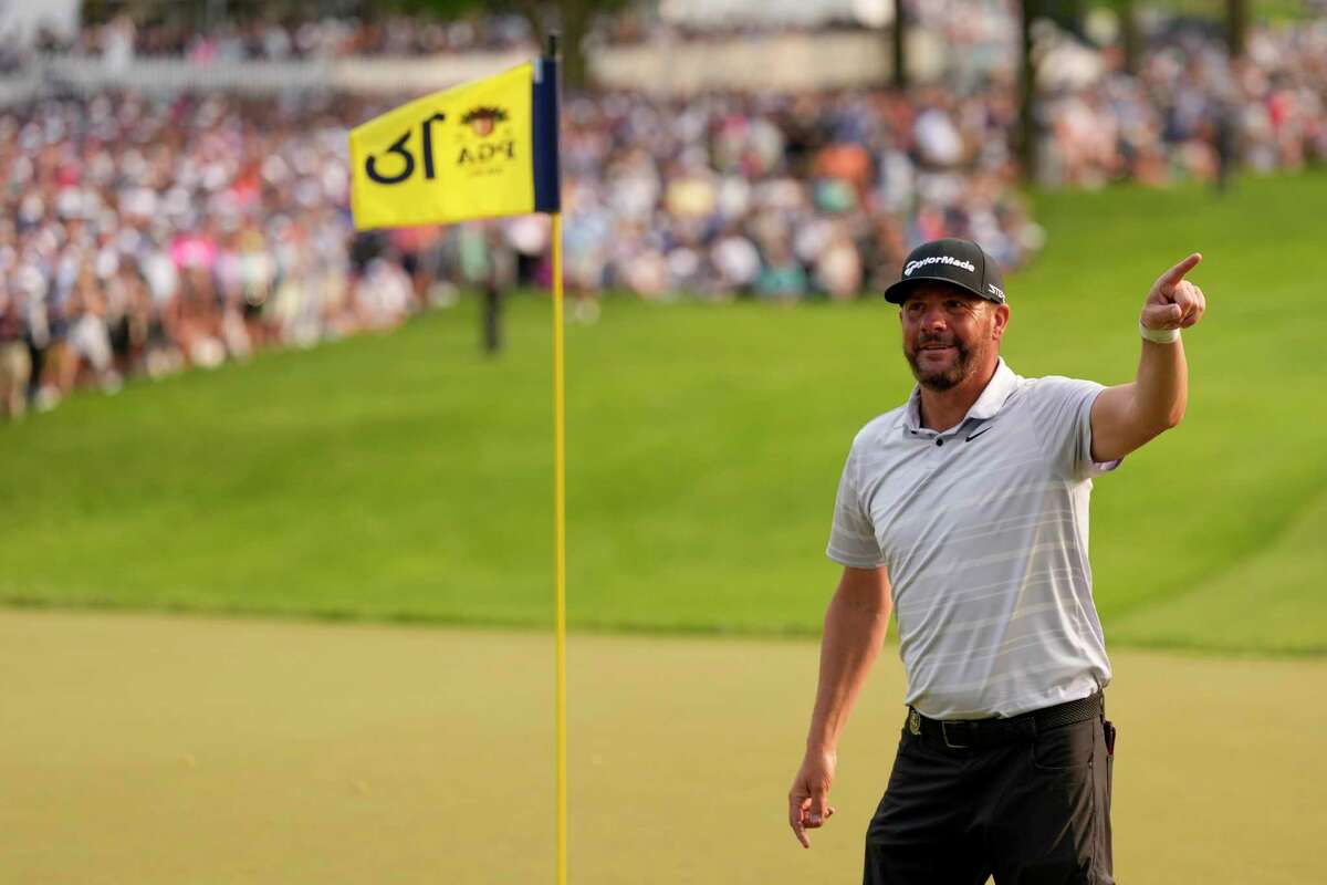Michael Block acknowledges the crowd on the 18th hole after his final round of the PGA Championship golf tournament at Oak Hill Country Club on Sunday, May 21, 2023, in Pittsford, N.Y.