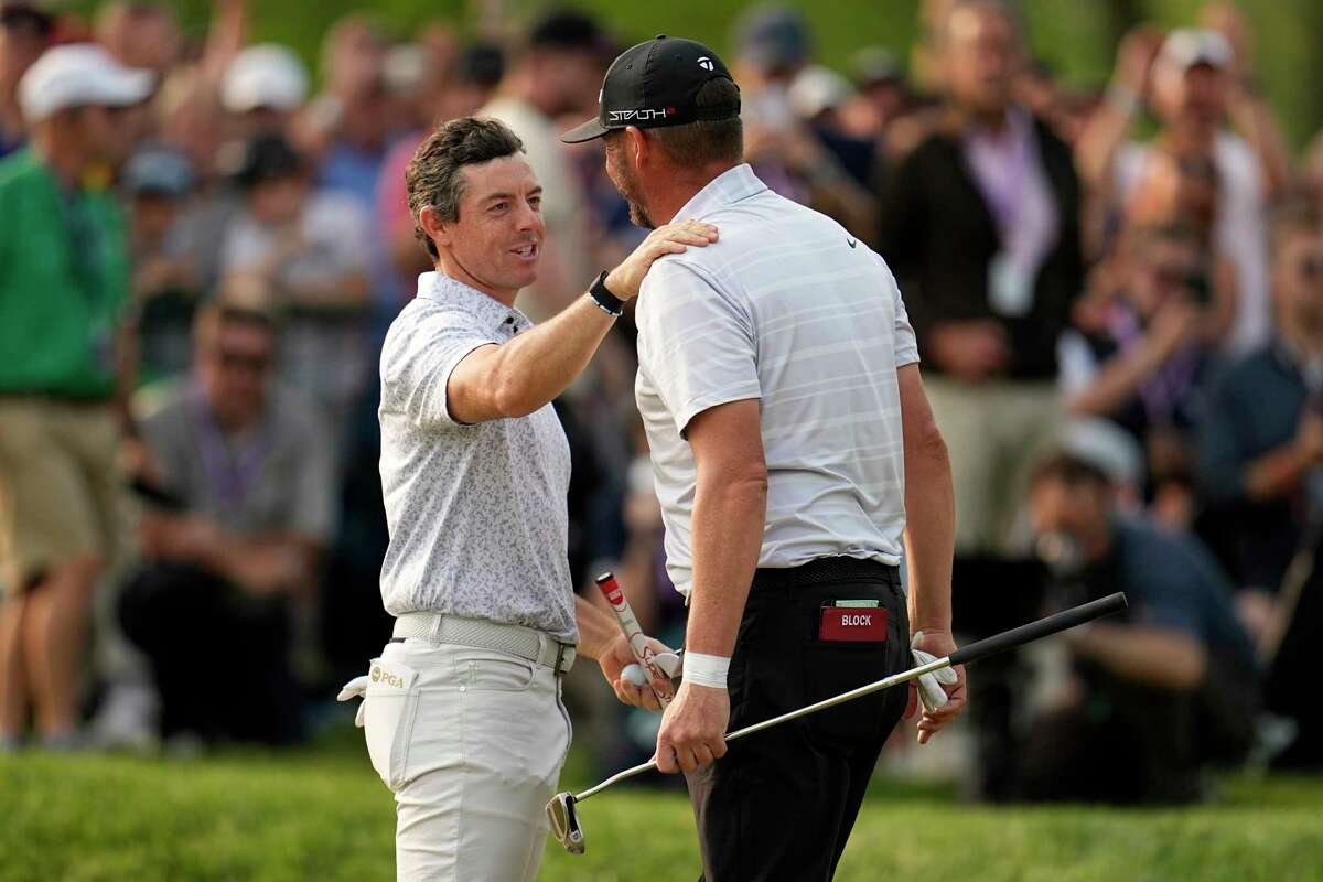 Rory McIlroy, of Northern Ireland, greets Michael Block after their final round of the PGA Championship golf tournament at Oak Hill Country Club on Sunday, May 21, 2023, in Pittsford, N.Y.