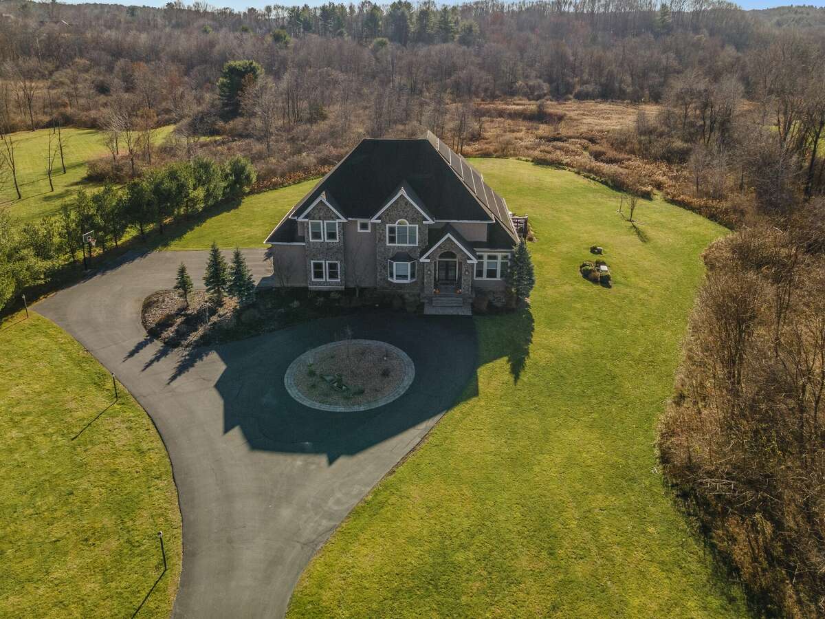 Altamont estate on 12 acres with finished basement for sale at 1.3M