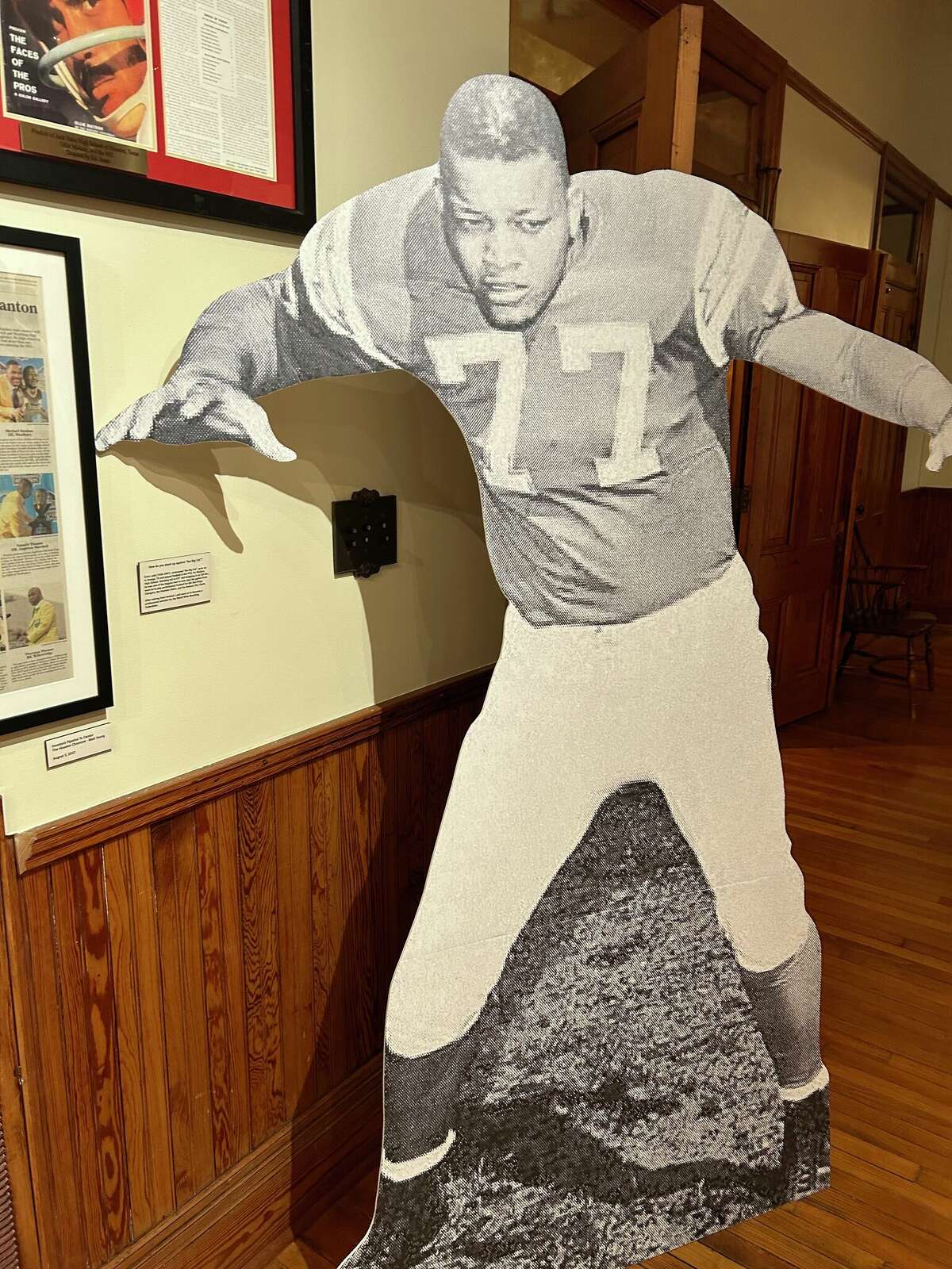 An Ernie Ladd cutout greets visitors at the "Thursday Night Lights" exhibit at the Bryan Museum