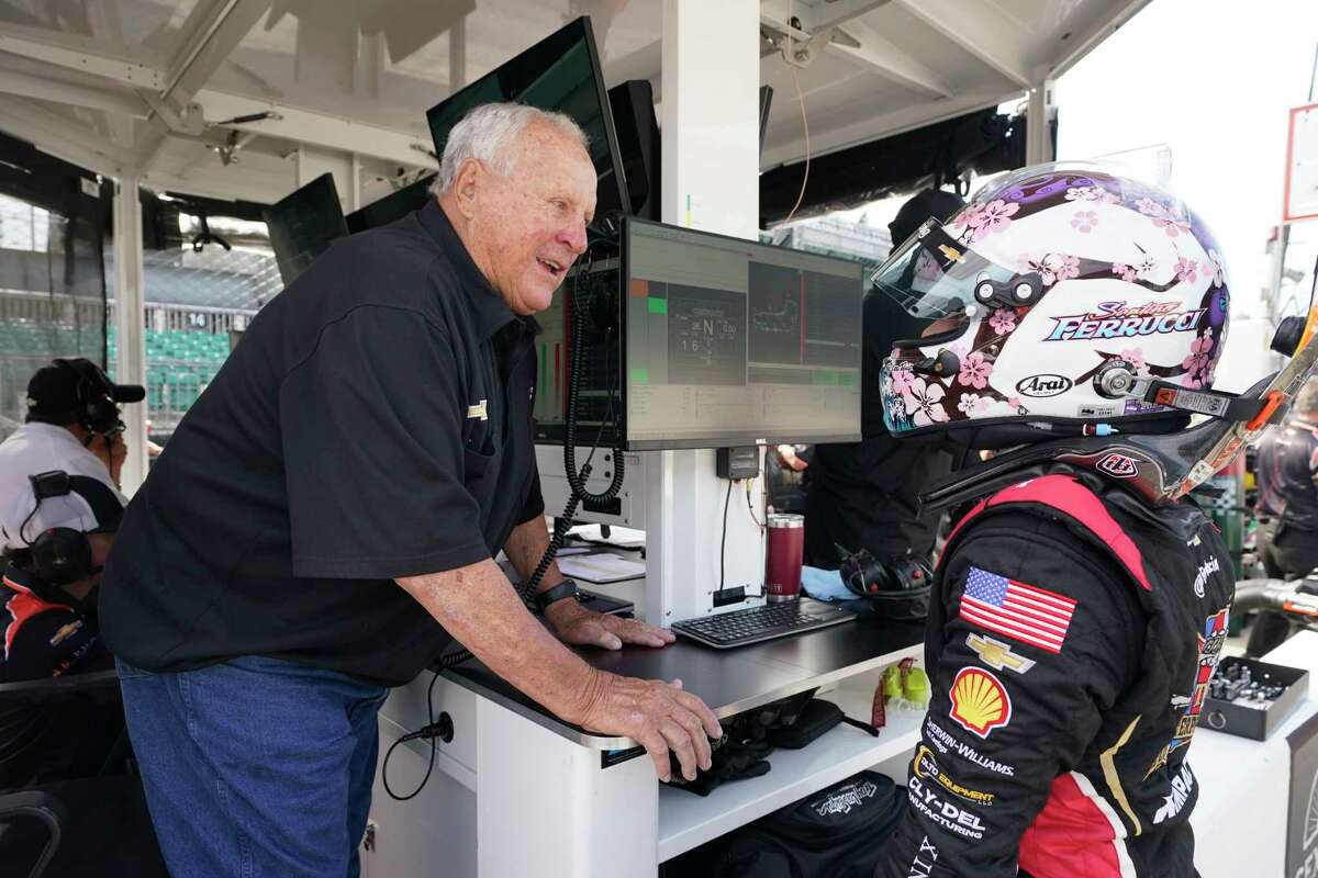 A. J. Foyt talks with Santino Ferrucci during practice for the IndyCar Grand Prix auto race at Indianapolis Motor Speedway, Friday, May 12, 2023, in Indianapolis.