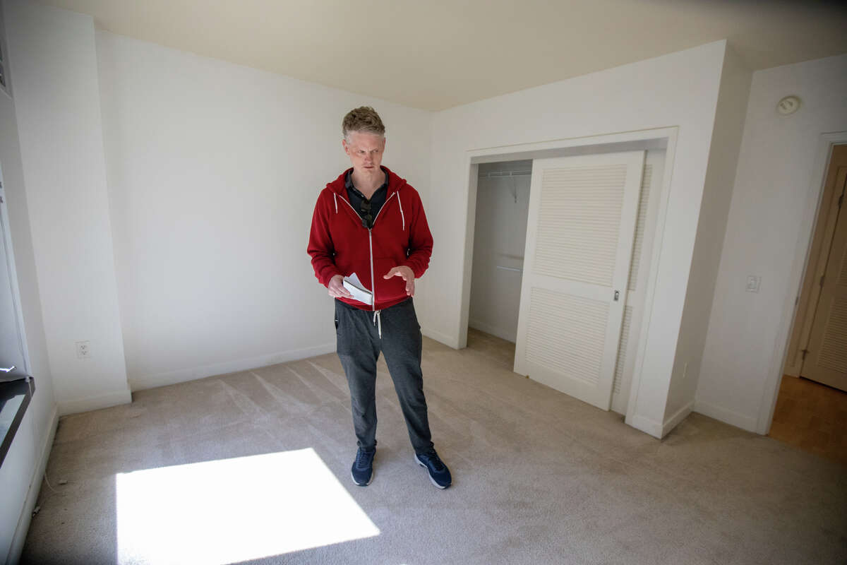 SFGATE columnist Drew Magary checks out a condominium available for sale on New Montgomery Street in the SOMA in San Francisco, Calif. on May 14, 2023.