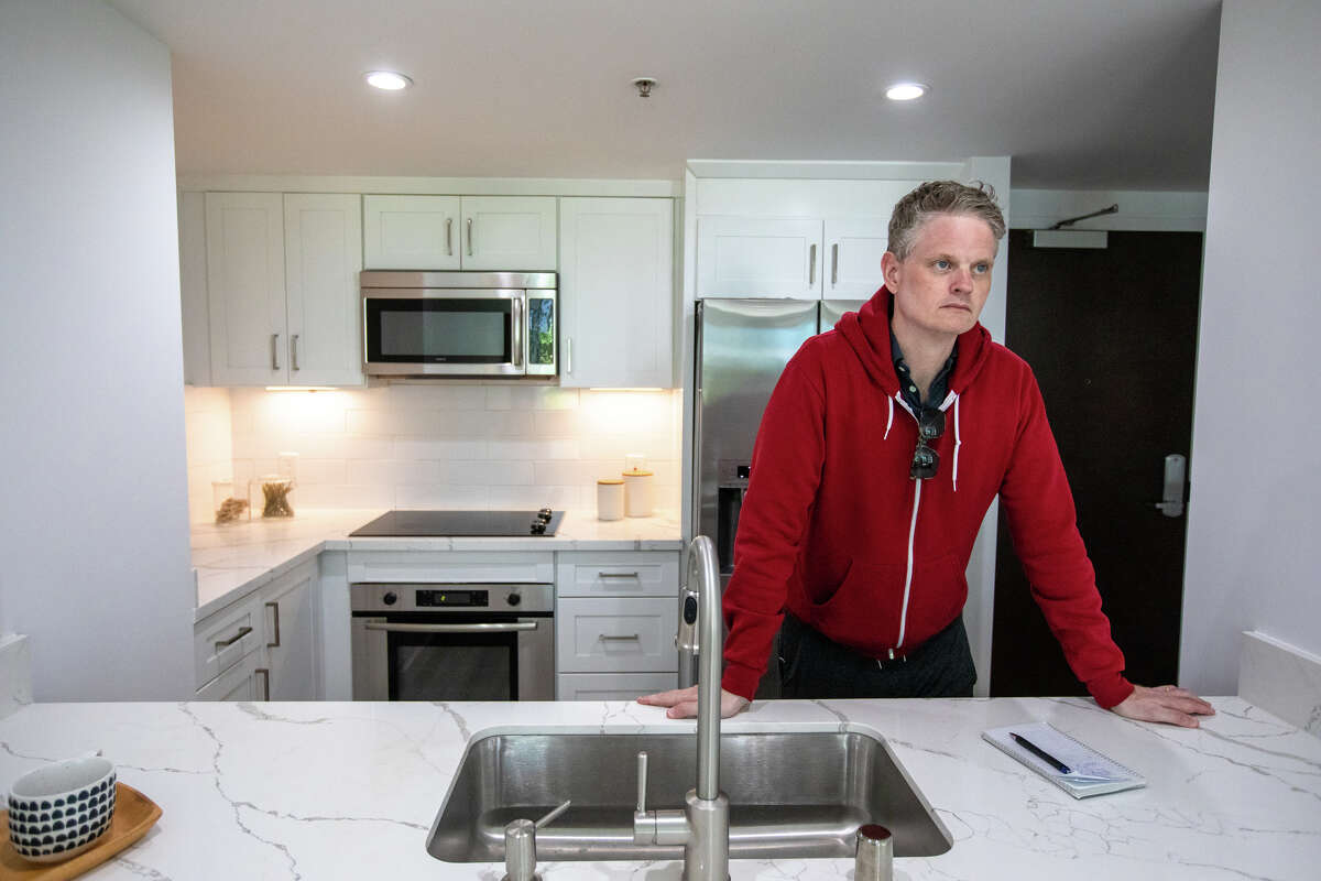SFGATE columnist Drew Magary checks out a condominium available for sale on 4th Street in the SOMA in San Francisco, Calif. on May 14, 2023.