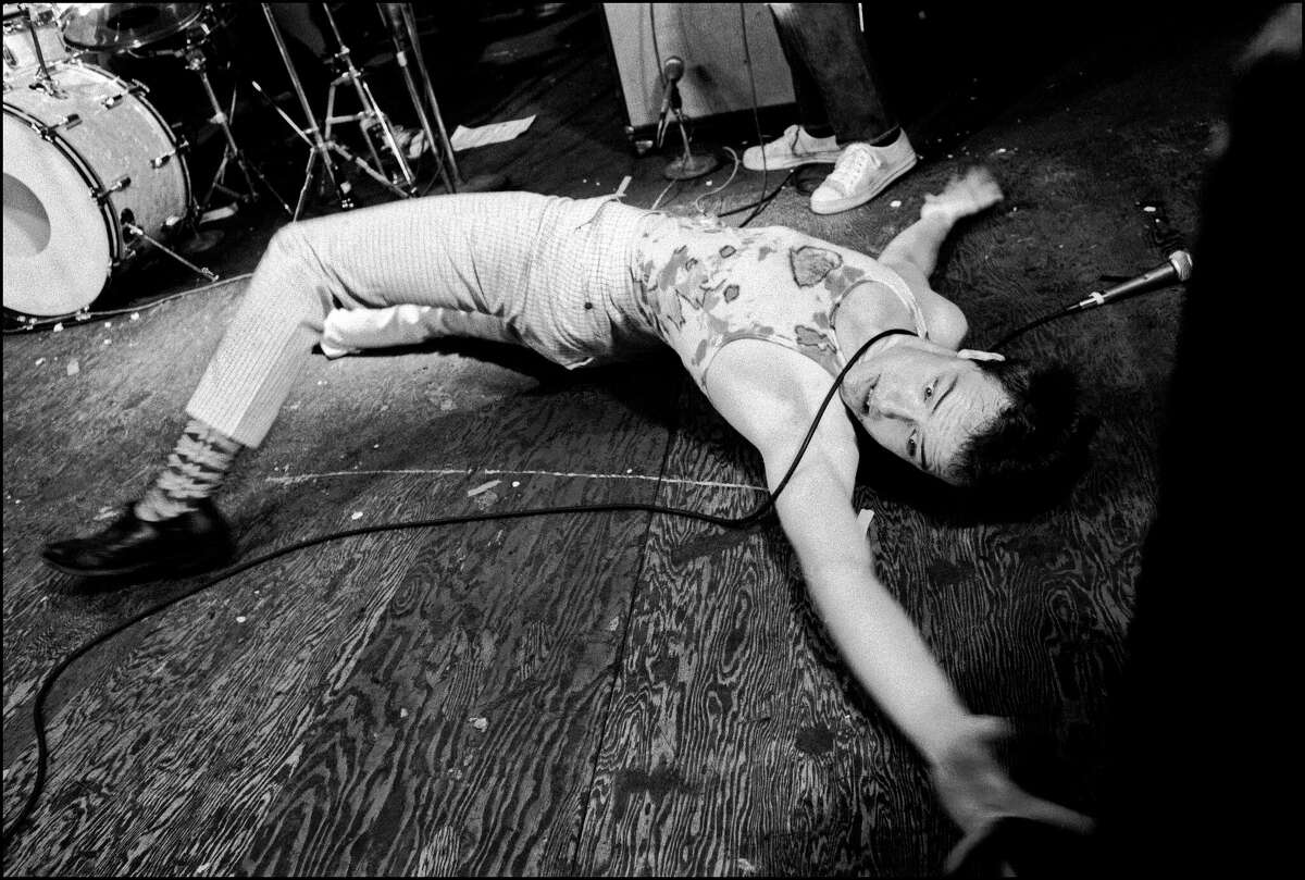 Jello Biafra of the Dead Kennedys on the stage's floor during a concert at the Mabuhay Gardens in San Francisco on Sept. 2, 1978. 