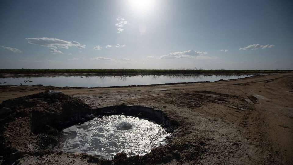 Gas and salty water bubbles out of a well on Lake Boehmer on Tuesday, April 25, 2023 near Imperial.