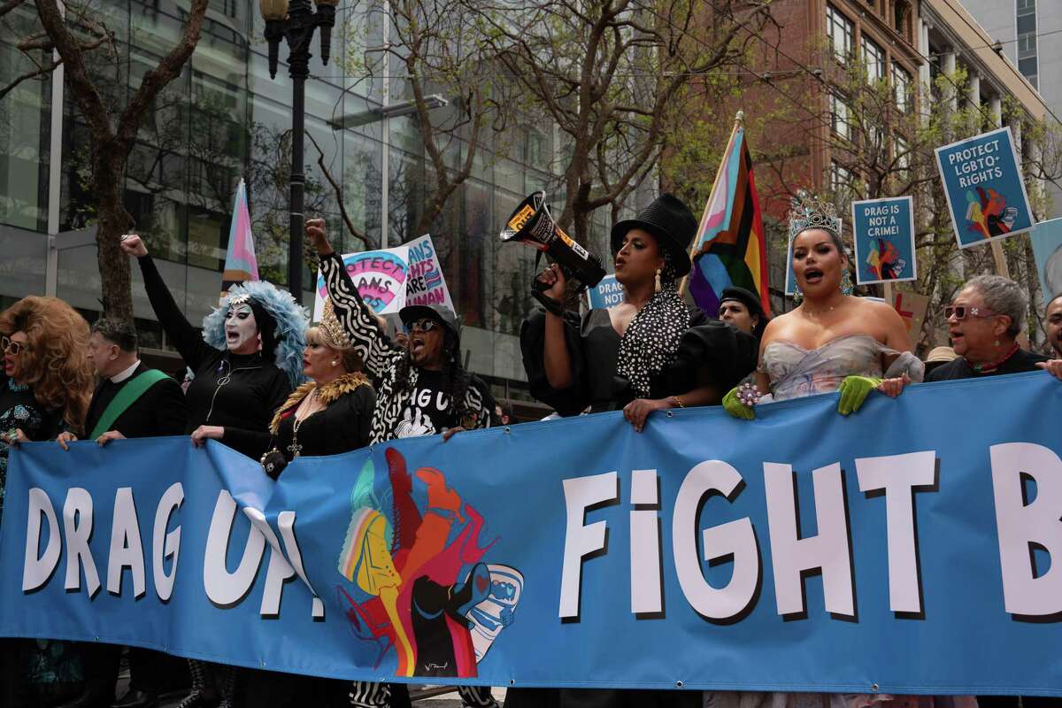 The first line of the “Drag Up! Fight Back!” march is seen marching on Market St. on Saturday, April 8, 2023 in San Francisco, Calif. Among the leaders of the march were Sister Roma, Queen Mother Nicole the Great, Alex U. Inn, and Honey Mahogany.