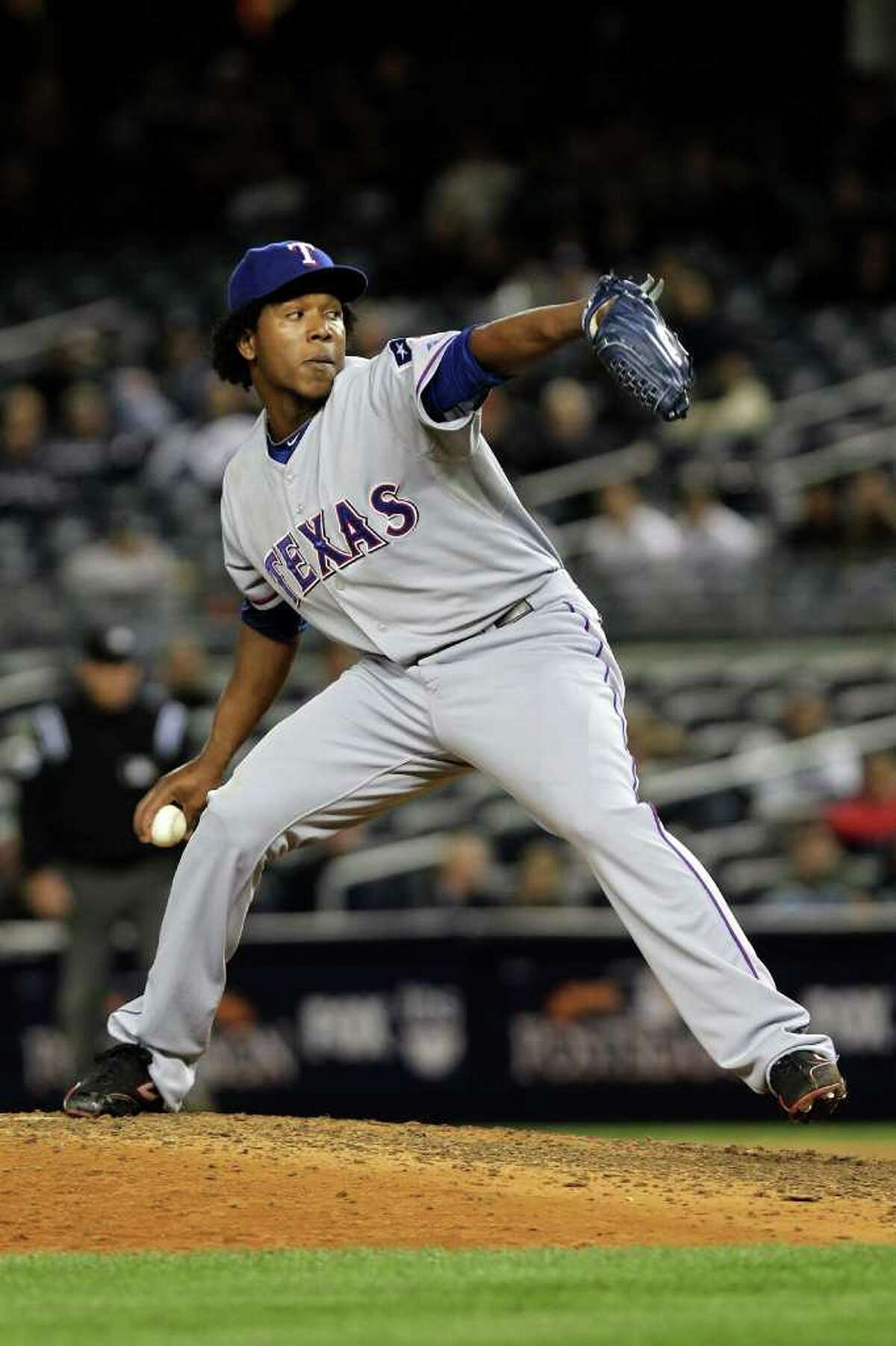NEW YORK - OCTOBER 18: Neftali Feliz #30 ofthe Texas Rangers pitches against the New York Yankees in Game Three of the ALCS during the 2010 MLB Playoffs at Yankee Stadium on October 18, 2010 in New York, New York. The Rangers won 8-0. (Photo by Nick Laham/Getty Images) *** Local Caption *** Neftali Feliz