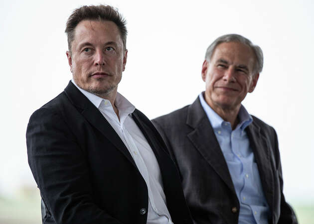 Tesla CEO, Elon Musk, left, sits with Texas Gov. Greg Abbott at a groundbreaking ceremony for the auto manufacturer's lithium refining facility in Robstown, Texas, on Monday, May 8, 2023. (Angela Piazza/Corpus Christi Caller-Times via AP)