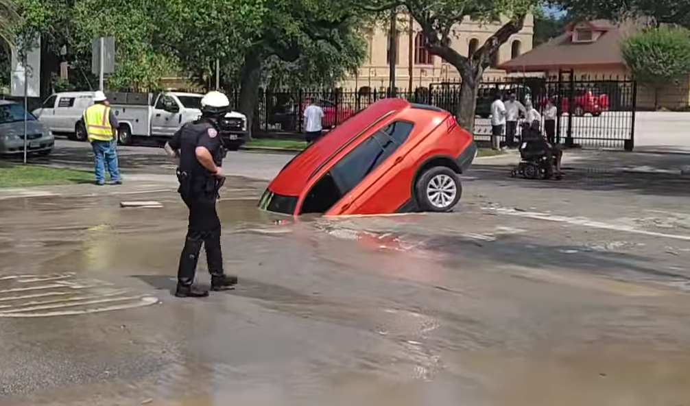 VIDEO: Massive sinkhole swallows car in middle of Galveston
