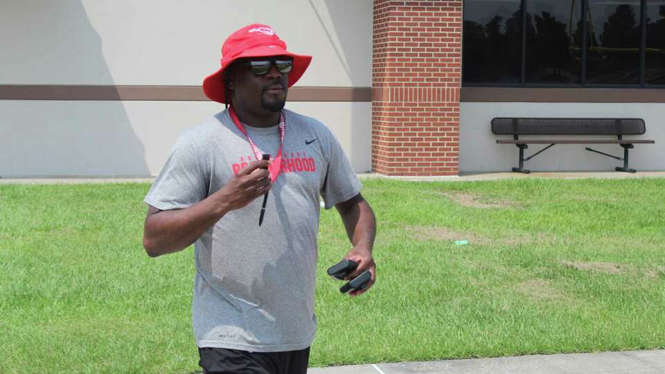 North Shore athletic director/football coach Willie Gaston walking on the field at Galena Park ISD stadium on the last day of spring practice.