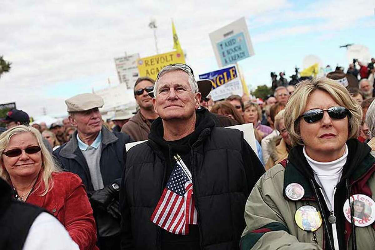 RENO, NV - OCTOBER 18: Tea Party supporters listen to speakers while attending the launch for the Tea Party Express national tour which kicked off with a rally in Reno on October 18, 2010 in Reno, Nevada. The tour, part of an initiative to get conservatives elected to the House and Senate, will move across country and conclude on November 1, 2010 in Concord, New Hampshire the day before the contentious Mid-Term elections. (Photo by Spencer Platt/Getty Images)